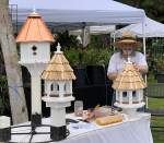 Bird houses with orange roofs at gardenfest