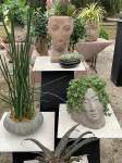 Face sculpture plant holders at gardenfest